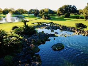 Golf course with water and a fountain