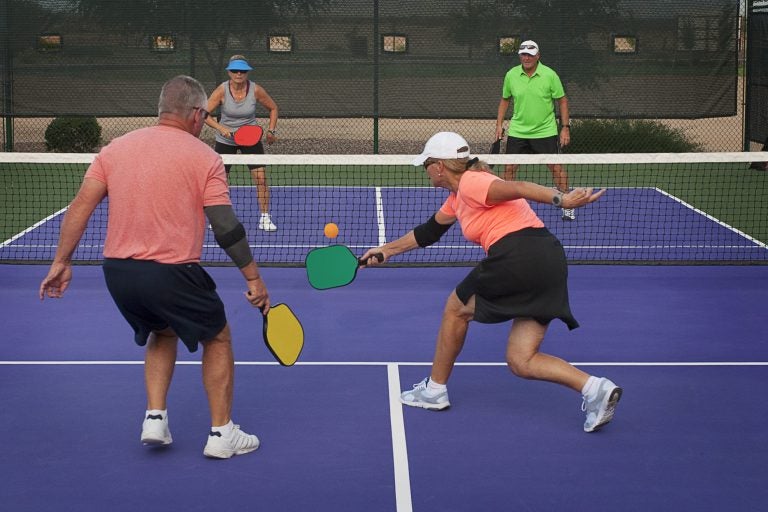 couples playing pickle ball