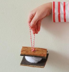 S'more ornament hanging from a red string