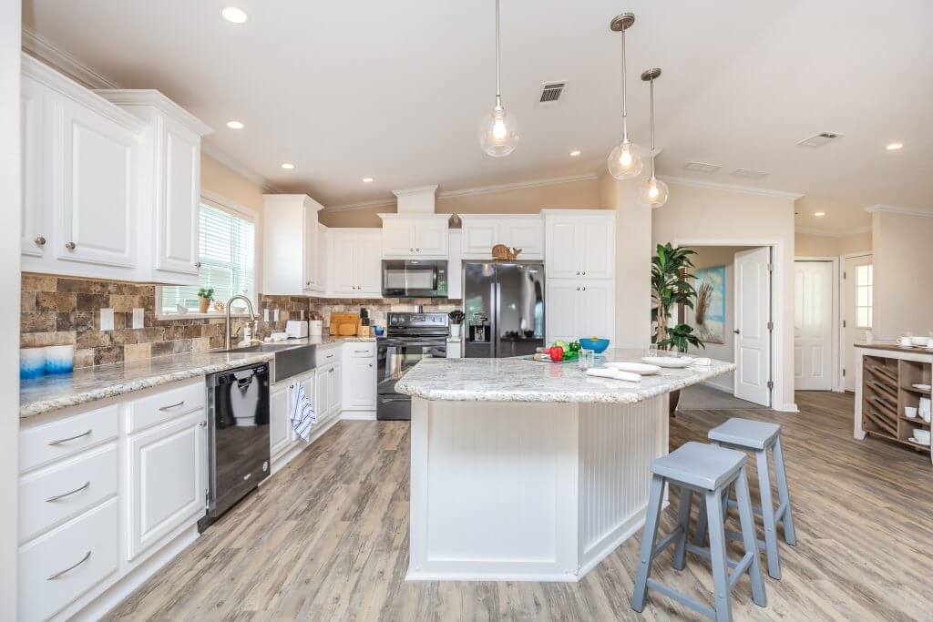 An interior view within a manufactured home showing the kitchen.