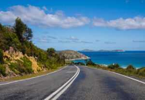 Road winding along the ocean