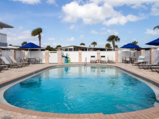 View of the outdoor pool and lounge chairs at The Waters.
