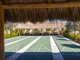View under tiki hut of the shuffleboard courts at Blueway RV Park in Fort Myers, FL.