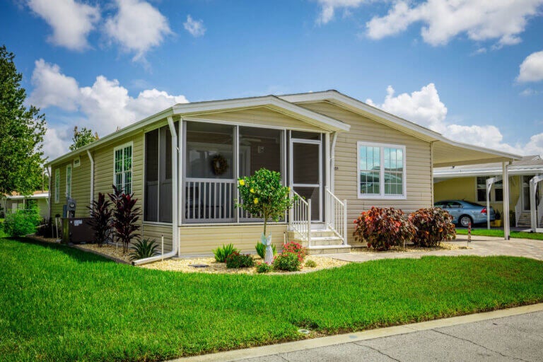 Yellow manufactured home in Lakeland, Florida at Cypress Lakes Village.