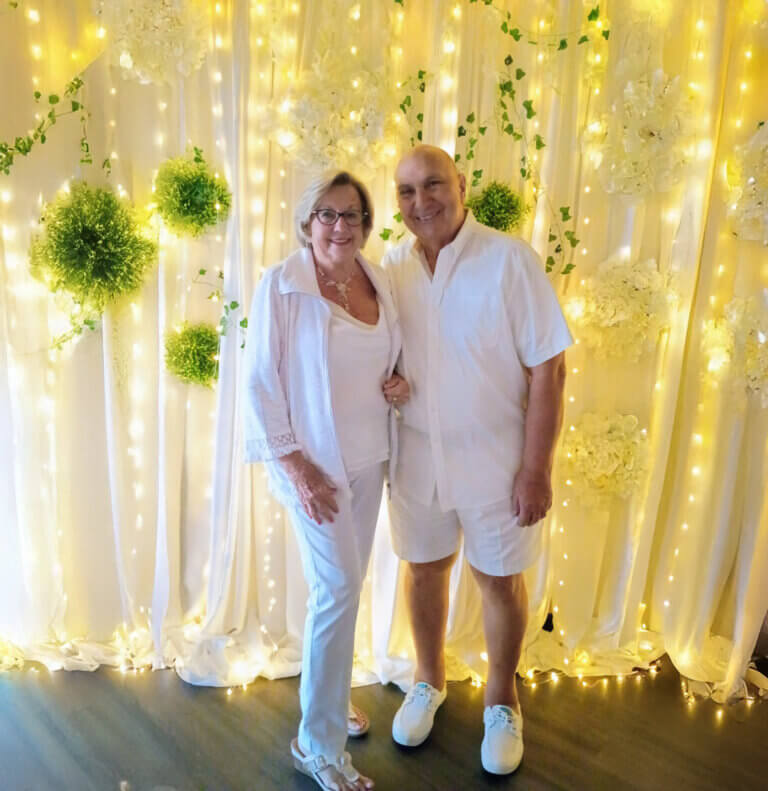 Residents at Camelot East Village pose for picture from the white party in January 2026