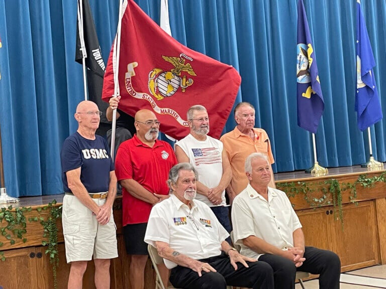 Veterans in Camelot Lakes being honored.