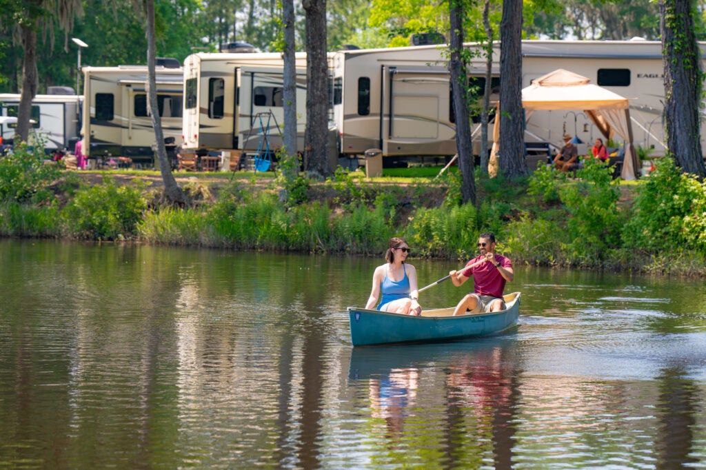 Couple canoeing in lake at Lake Jasper