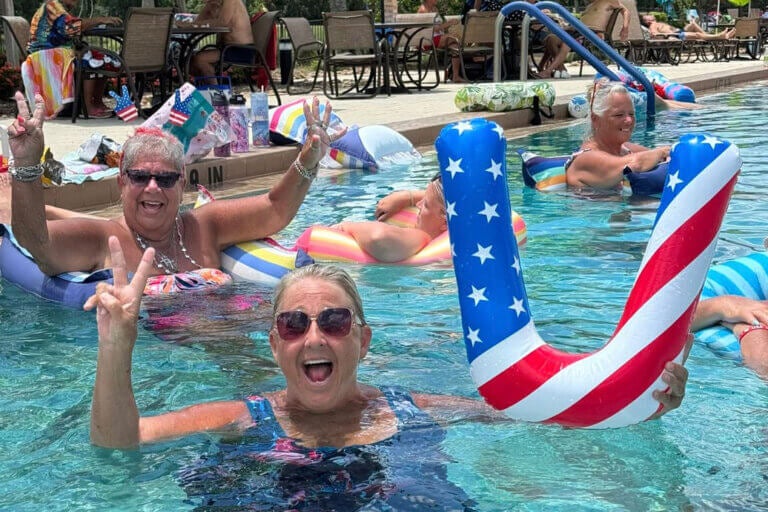 People floating in the swimming pool at Cypress Lakes Village in Lakeland, Florida