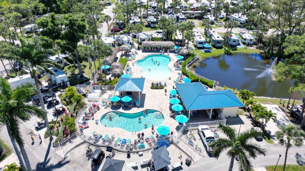 Overview photo of people swimming in the two pools at Blueway RV Park in Fort Myers, FL.