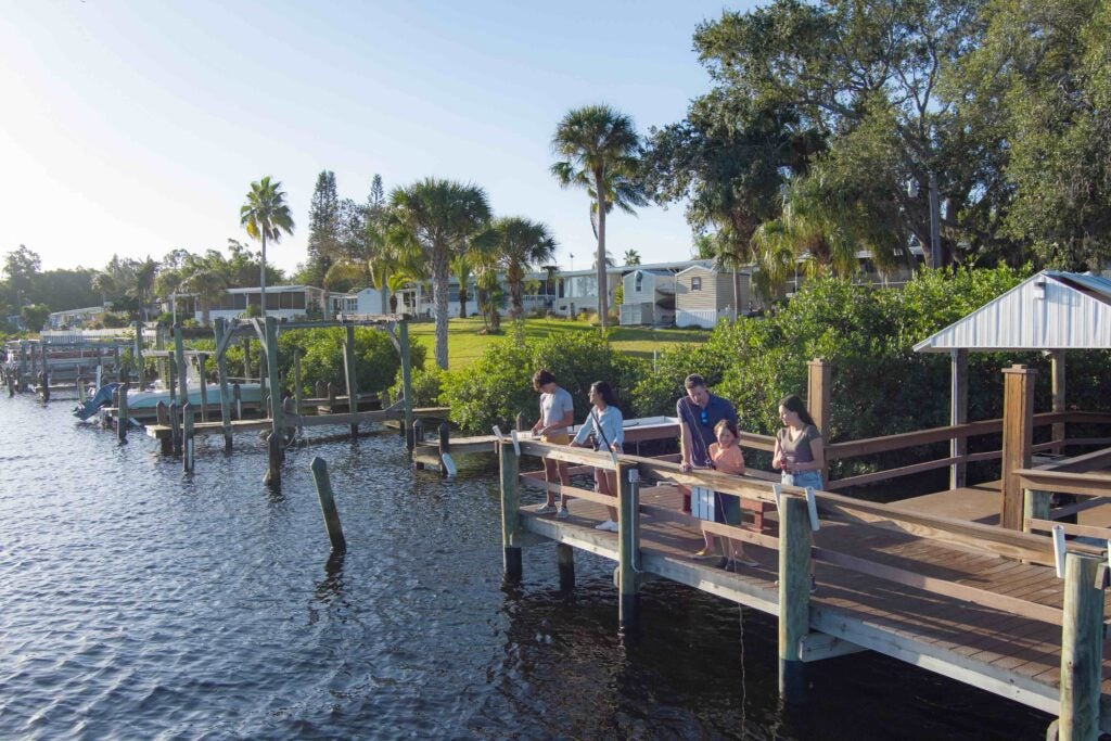 River Vista RV - Family fishing on dock