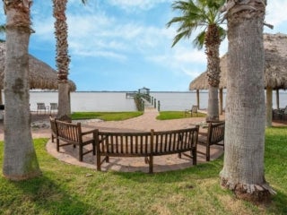 Fire pit and seating area over looking the dock