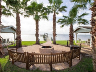Fire pit and seating area over looking the dock