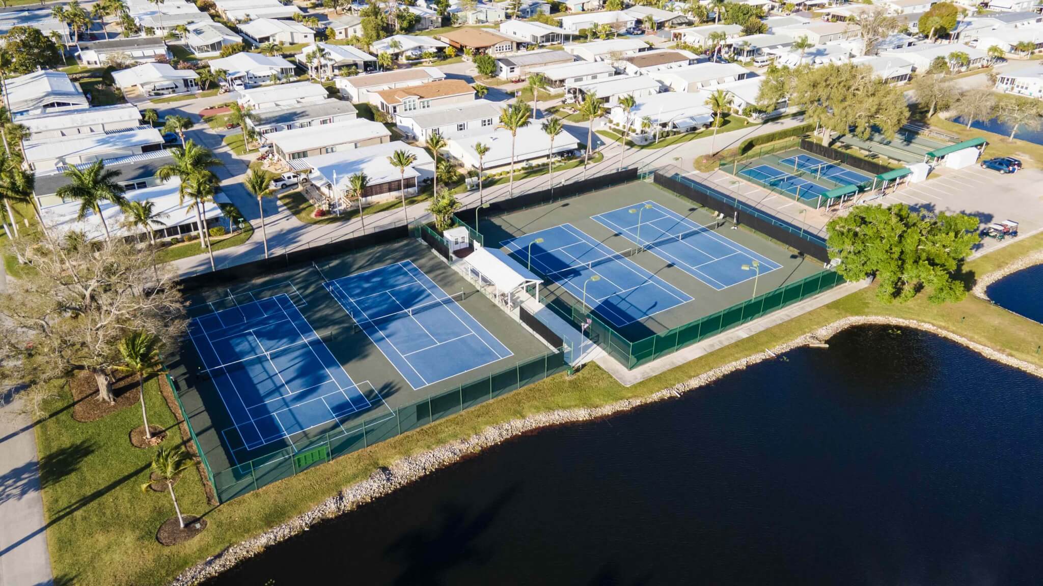 Overhead view of the lake and pickleball courts at Jamaica Bay Village.