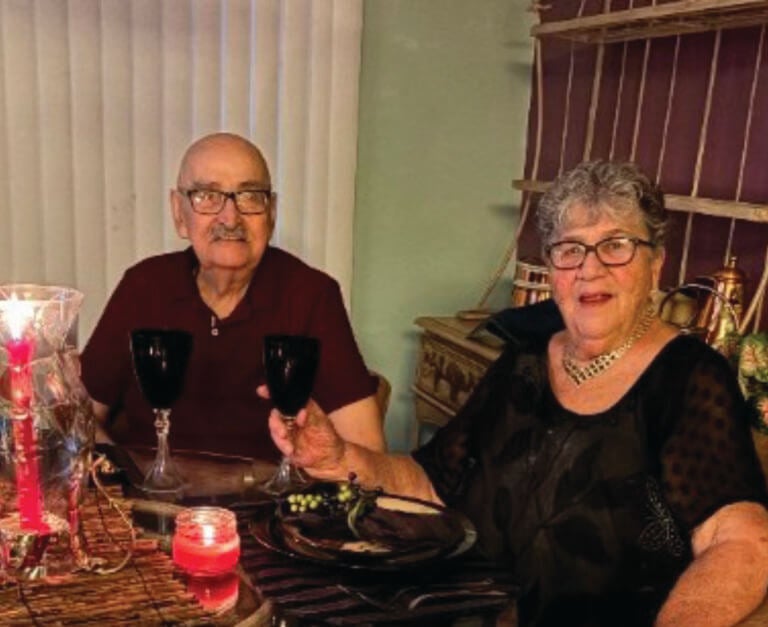 Jeannie and Lee Lewis of StrawBerry Ridge Village sitting together at a table