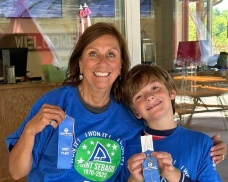 Julie Rondeau and her grandson showing off their Point Sebago Resort "I Won It" shirts.