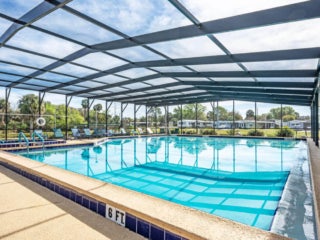 Inside view of the covered indoor swimming pool at Lake Griffin Harbor Village in Florida.