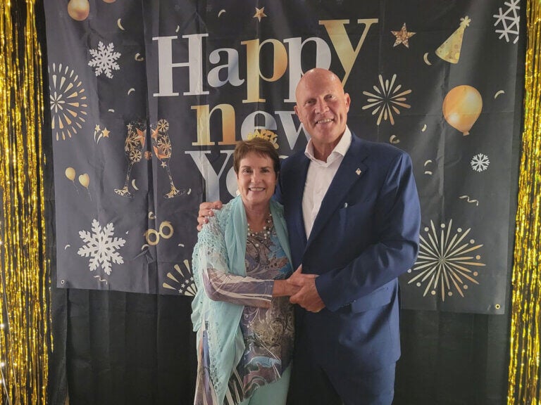 Couple posing for a photo during the Camelot East Village New Years Eve party in 2024.