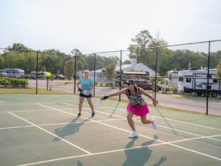 RV site guests playing pickleball at CreekFire RV Resort in Savannah, GA