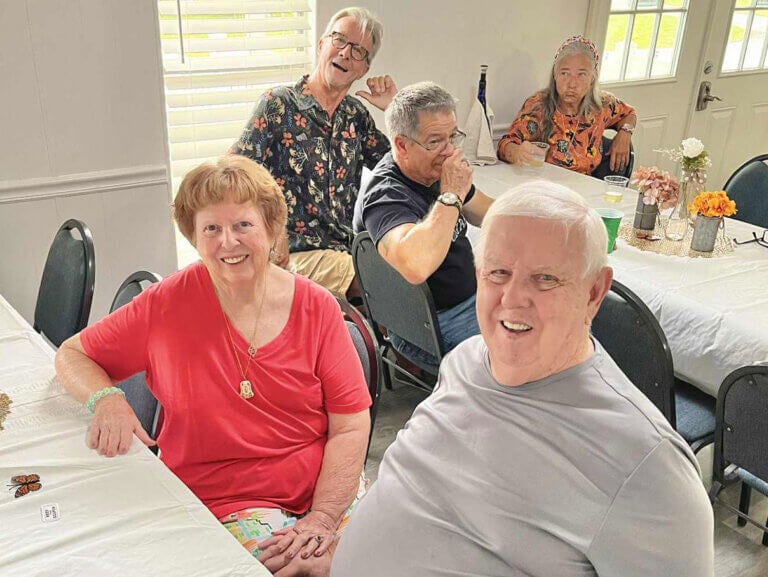 Two Meadowlea Village residents at dinner with friends.