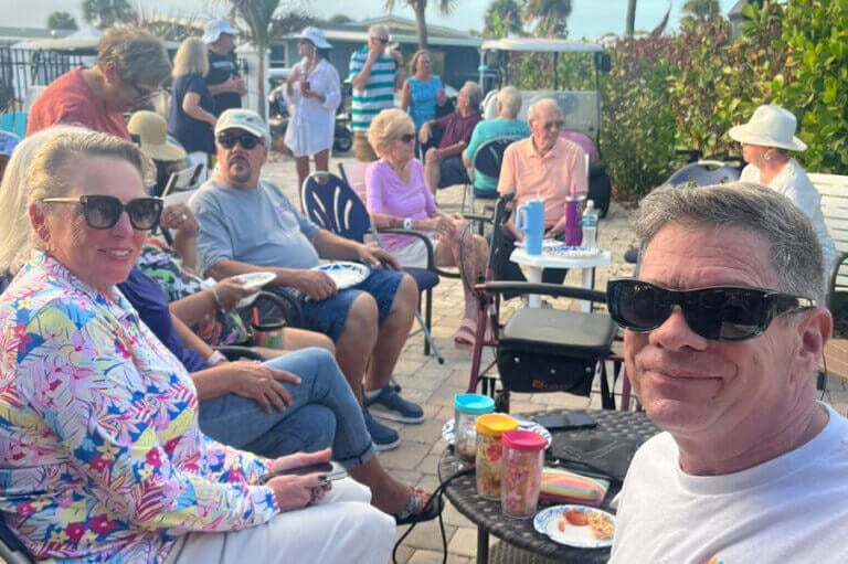 Residents at a potluck party at The Waters in Florida.