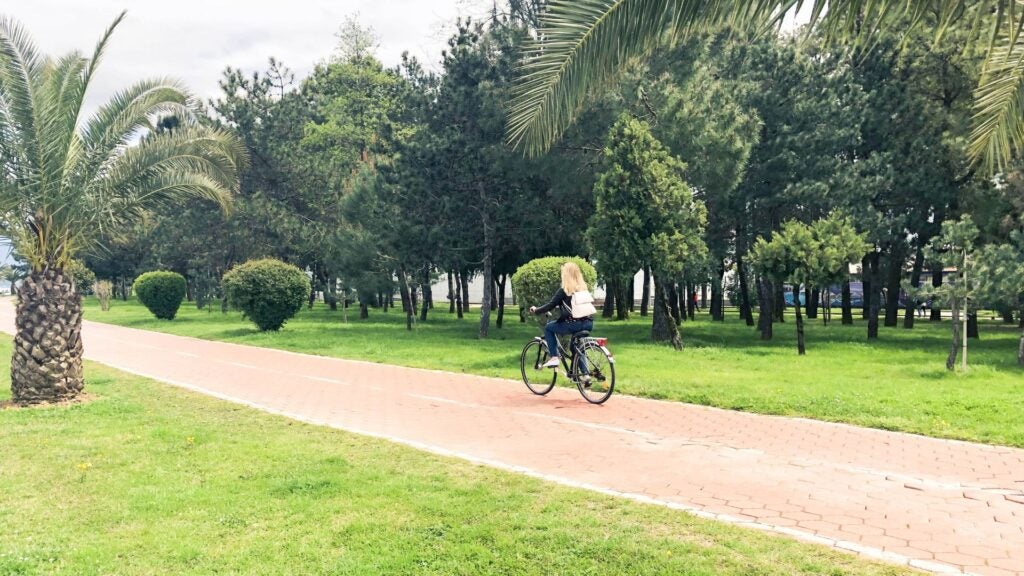 girl riding bike down trail