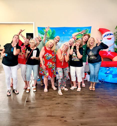 Residents celebrate Christmas in July with a themed karaoke night at The Meadows in Tarpon Springs, Florida.