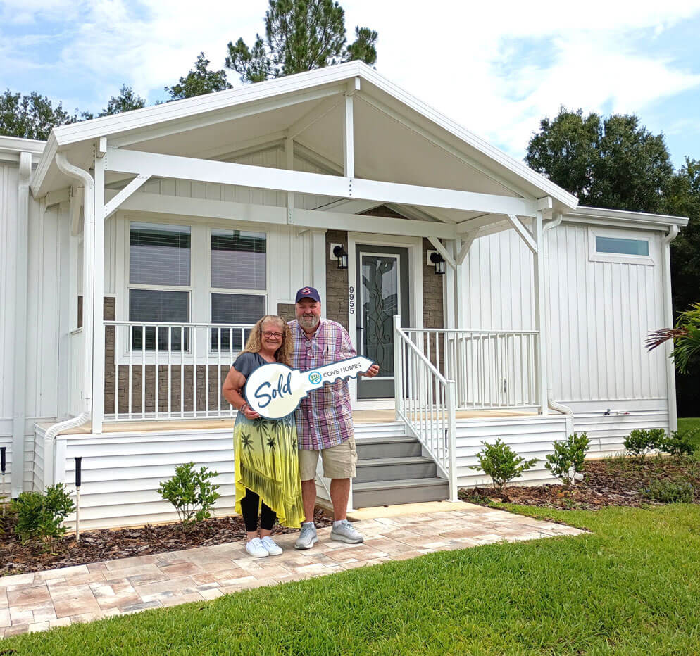 delattre-homebuyer-cypress-lakes-village Couple standing outside their new Lakeland, Florida home in Cypress Lakes Village.