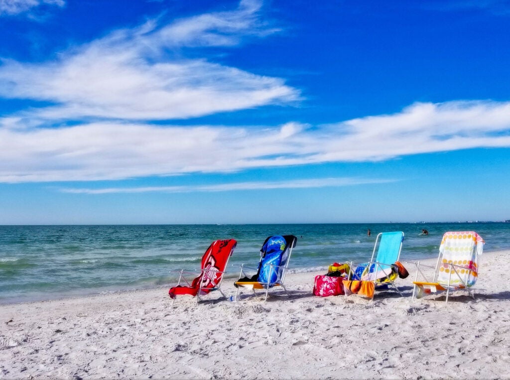 beach chairs on white sandy beach