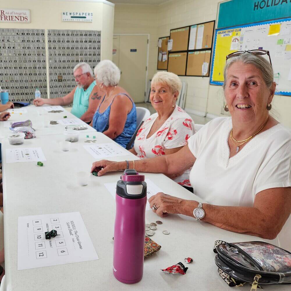 Guests and residents play a dice game called nickels at the Activity Center in Holiday RV Park in Leesburg, Fl.