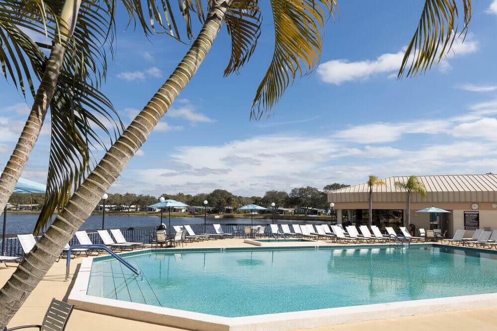 Swimming pool along the lake at Camelot East Village in Sarasota, Florida.