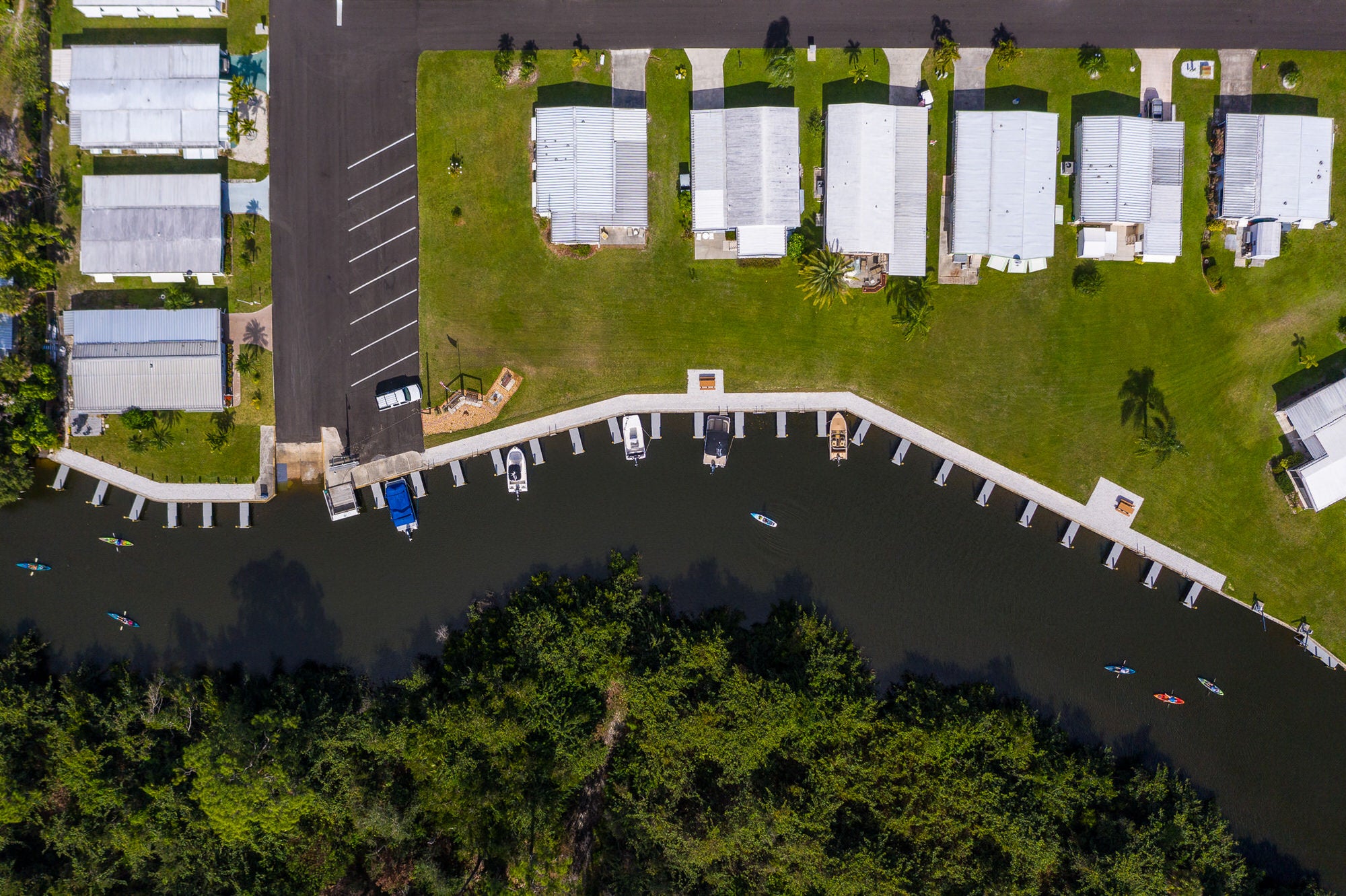 row of homes overlooking river at estero bay village