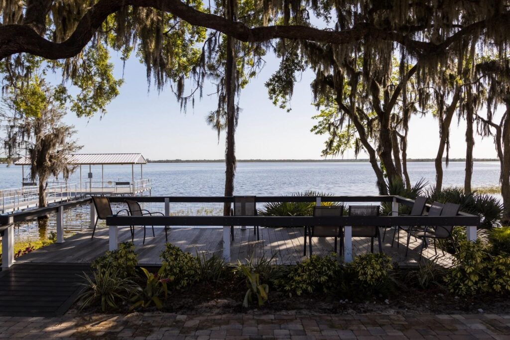 Wooden dock next to lake at Oak Harbor RV Park in Florida