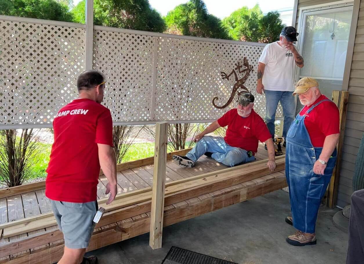 Residents at Cypress Lakes Village in Lakeland, FL. building a ramp for resident