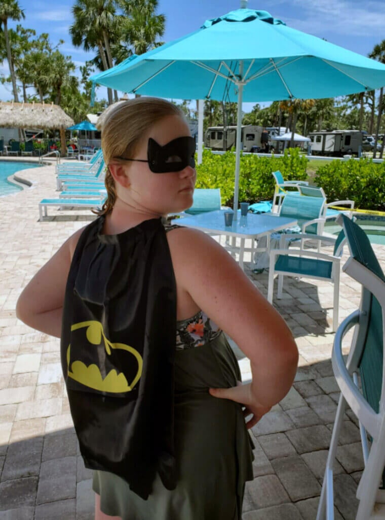 Guest at Blueway RV in a superhero costume at the pool party