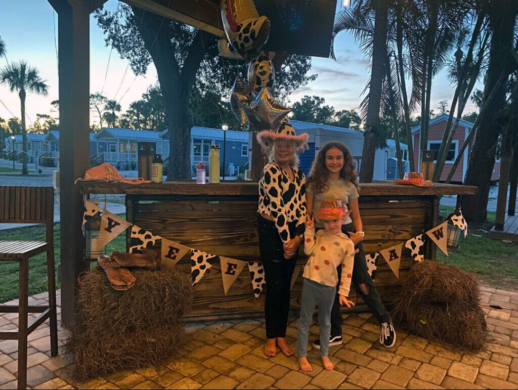 Three young girls at Blueway RV in their Western Cowgirl apparel for a themed event