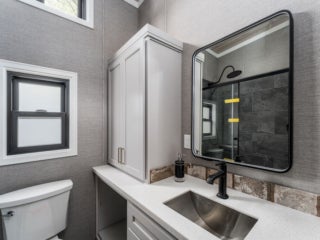 Bathroom inside the model cottage at Point Sebago. The photo shows an park model created by Elevation.