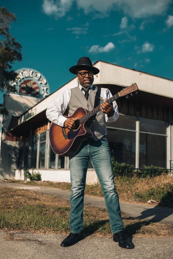 Bill Buchannon, a Florida musician playing the guitar