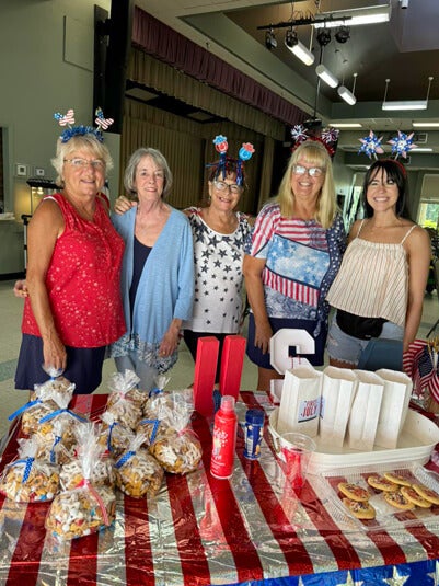 Ladies at Cypress Lakes Village in Lakeland, Florida celebrate independence day with red white and blue decor
