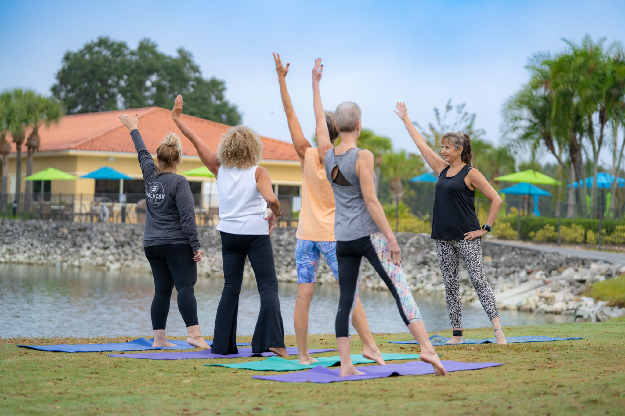 Residents at Cypress Lakes Village in Lakeland, FL. doing yoga outside.