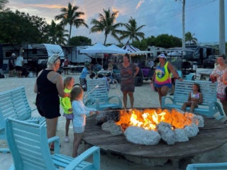 Campfire_Big_Pine_Key_RV_Resort Families gathered around the campfire in Florida at Bike Pine Key RV Park.