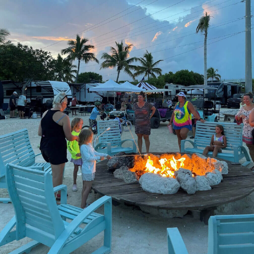 Families gathered around the campfire in Florida at Bike Pine Key RV Park.