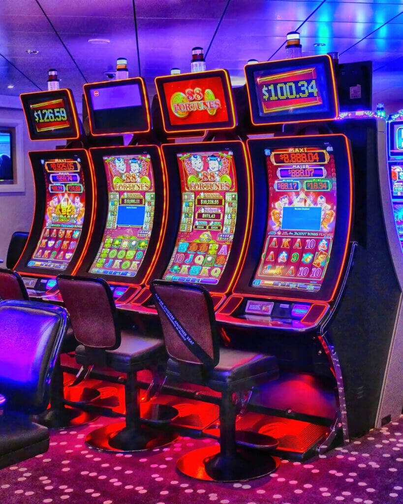 a casino room on a cruise ship with slot machines