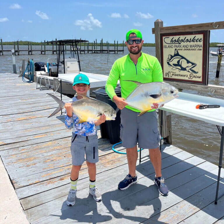 Father and son fishing at Chokoloskee RV Park in Florida.