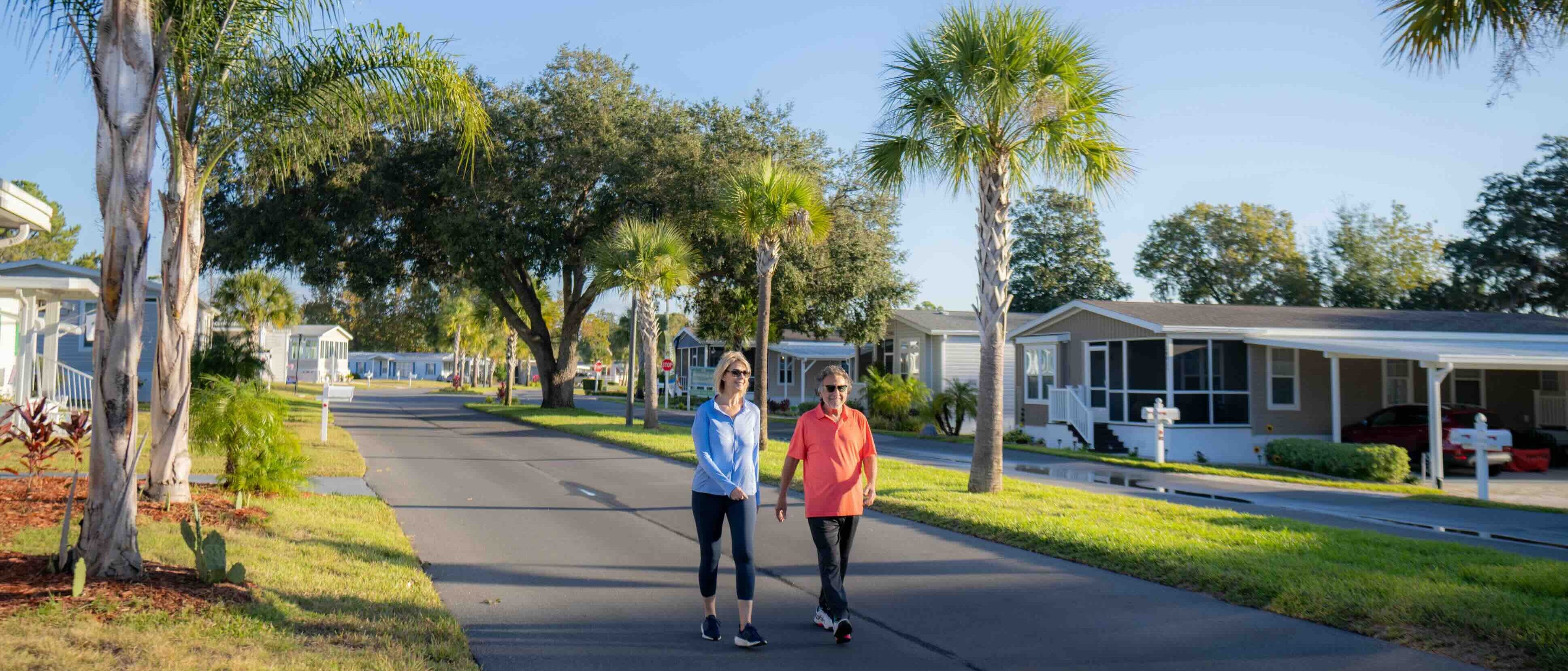 Couple walking through Rolling Greens Village in Ocala, Florida.