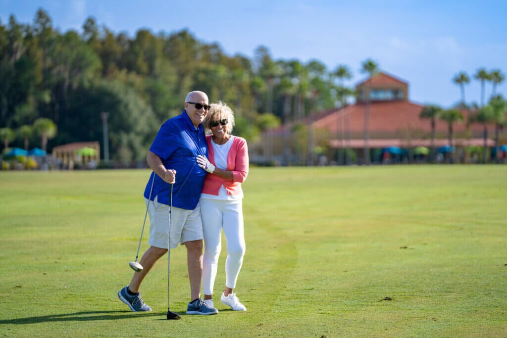 Couple embracing on the green at Big Cypress Golf Club in Lakeland, Florida.