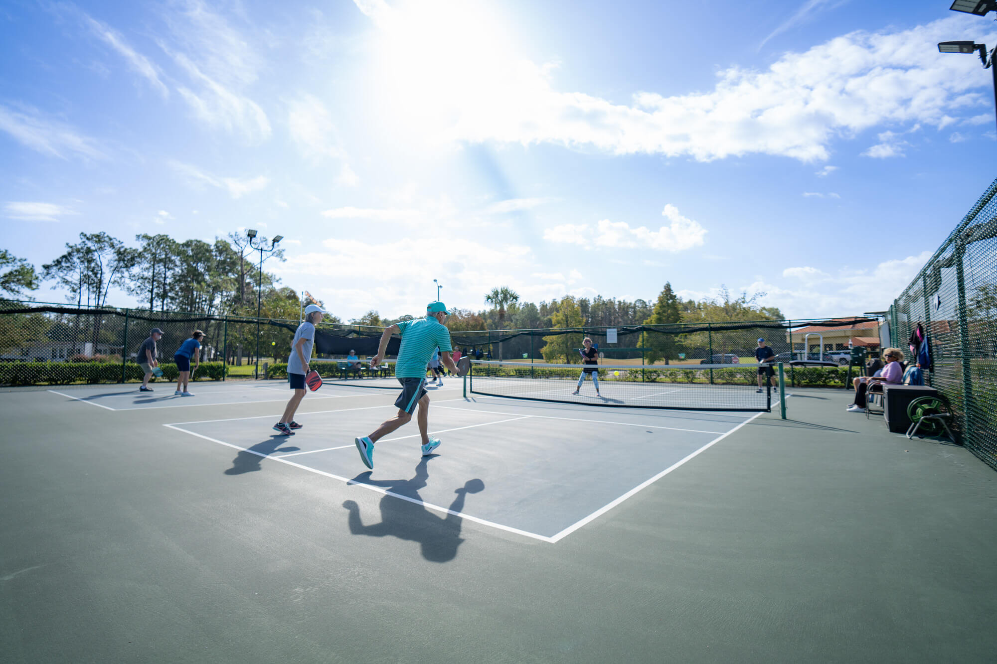 residents playing pickleball at cypress lakes