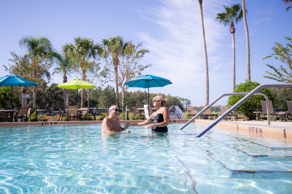 Cypress Lakes Village - couple in pool