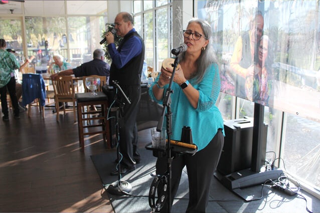 Music duo, Carlos & Company performs live for 55+ residents at big Cypress Grill at Cypress Lakes Village in Lakeland, FL.