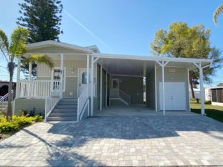The front exterior of the new manufactured home at 10 Sophie Avenue, Dunedin, Florida 34698 in Dunedin Village.