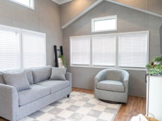 Inside the living room of an Elevation park model cabin at Sebago Lake at Point Sebago Resort.